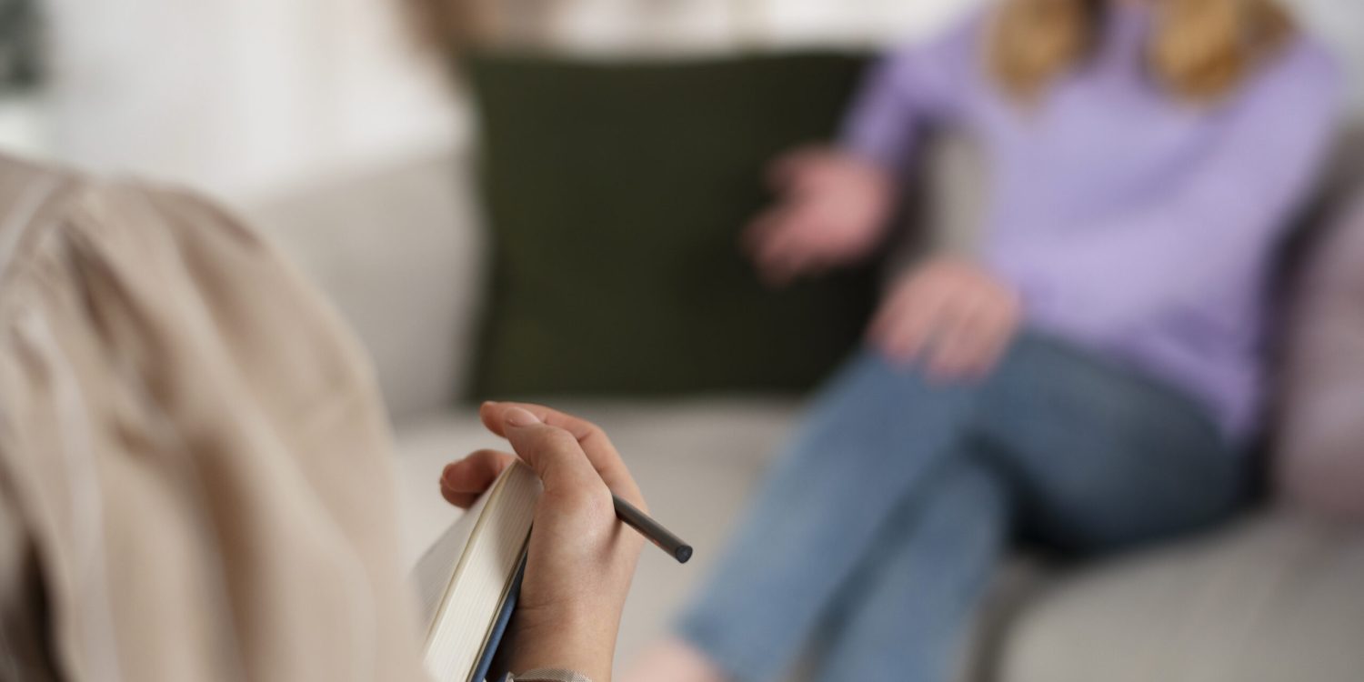 sided-view-young-girl-talking-therapist